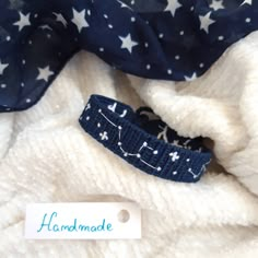 the fabric has stars on it and is blue with white dots, which are used for hair accessories