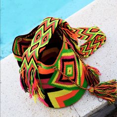 100% Authentic Wayuu Bag Handcrafted By Indigenous Tribe In Colombia. Each Bag Is Unique Art Work That Follows Hundred Years Of Traditions And Believes Of The Tribe. Bag Are Approximately 9 To 13 Inches In Diameter And Depth The Strap Measure Between 32 And 40 Inches. One Of A Kind New Without Tags. Yellow Large Capacity Bucket Bag, Large Capacity Yellow Bucket Bag, Yellow Bucket Bag With Adjustable Strap, Yellow Pouch Bucket Bag For Daily Use, Yellow Adjustable Strap Pouch Bucket Bag, Yellow Bucket Bag For Daily Use, Yellow Bucket Bag, Yellow Bag With Removable Pouch For Vacation, Yellow Summer Satchel Bucket Bag