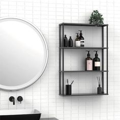 a bathroom with a sink, mirror and shelving unit in the middle of it