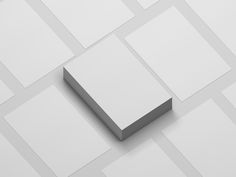 a white box sitting on top of a floor covered in squares