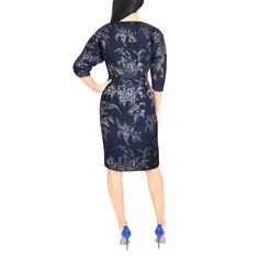 Introducing our unique navy blue midi dress made of lightweight silk cloque from Italy. The shimmery floral jacquard pattern, sculptured sleeves, and wrap-around skirt with a split on one side create a flattering silhouette. Lined with silk, this limited edition dress is crafted for a comfortable fit.  Perfect for special occasions, the luxurious fabric and subtly foiled pattern will make you stand out and feel confident. The split on the side of the skirt adds an extra touch of elegance and all Navy Blue Midi Dress, Unique Dress, Wrap Around Skirt, Luxurious Fabric, Floral Jacquard, Jacquard Pattern, Pearl Jewellery Earrings, August Birth Stone, Blue Midi Dress