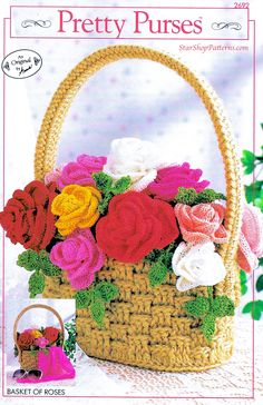 a basket with flowers in it sitting on top of a table