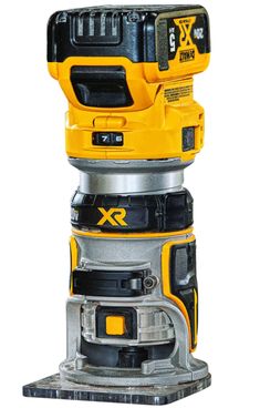 a yellow and black driller sitting on top of a metal stand with an xr logo