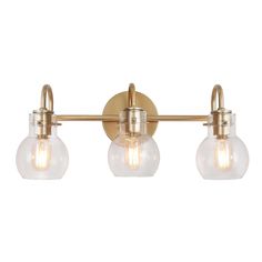 three light bathroom fixture with clear glass globes on the sides and gold metal fixtures