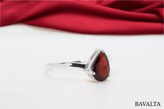 Formal Teardrop Birthstone Rings, Elegant Teardrop Ring With Gemstone Accents, Elegant Teardrop Rings With Gemstone Accents, Elegant Drop Rings With Prong Setting, Elegant Teardrop Gemstone Rings, Elegant Pear-shaped Ring With Gemstone Accents, Ring Teardrop, January Birthstone, Garnet Ring