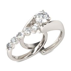 two white gold wedding rings with diamonds on each band and an oval cut diamond in the middle