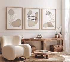 a living room with three paintings on the wall