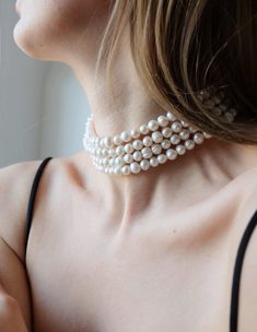 Add a touch of elegance and sophistication to your look with our stunning four-row pearl choker. Made with high-quality materials and expert craftsmanship, this choker necklace is a true statement piece that's sure to turn heads. Featuring fpur rows of lustrous pearls, this choker is designed to sit comfortably on your neck, making it the perfect accessory for special occasions or everyday wear. The pearls are carefully selected for their consistent size, shape, and luster, ensuring that each necklace is of the highest quality. The choker itself is made from durable materials, ensuring that it will last for years to come. The clasp is easy to use and secure, ensuring that the necklace stays in place throughout the day or night. Whether you're dressing up for a formal event or adding a touc Layered Pearl Choker, Moti Choker Necklace, Moti Choker, Jewellery Photography, Bracelets Easy, Real Pearl Necklace, Chunky Pearls, Wedding Necklaces, Pearl Chain Necklace