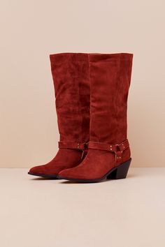 Create signature looks all season long with the help of the Lulus Assia Rust Suede Slip-On Knee-High Moto Boots! Ultra-soft faux suede shapes these slip-on boots with a pointed-toe upper that rises to a 13"" knee-high shaft with a 14.75"" circumference. Three matching studded straps come together at the outstep and instep via a bronze O-ring for a moto-inspired effect. A stacked block heel completes the look! 2. 5" stacked block heel. Cushioned insole. Rubbed sole has nonskid markings. Man Made Wide Calf Suede Mid-calf Boots With Pointed Toe, Chic Suede Snip Toe Boots, Wide Calf Suede Knee-high Boots, Winter Suede Heeled Boots With Snip Toe, Western Wide Calf Suede Knee-high Boots, Western Style Suede Wide Calf Knee-high Boots, Western Suede Wide-calf Knee-high Boots, Fall Suede Moto Boots Medium Width, Wide Calf Suede Mid-calf Boots For Fall