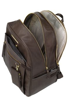 a brown leather backpack with zippers on the front and side pockets, open to reveal an inner compartment