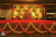 an orange and white wedding decorated with flowers