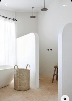 a white bath tub sitting next to a window