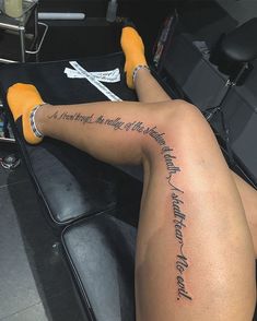 a woman's legs with writing on them