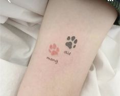 a person with a dog paw tattoo on their left arm and the words, all is moving