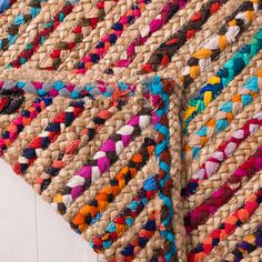 two woven rugs with different colors and patterns on the top one is multicolored