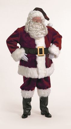 a man dressed as santa claus standing in front of a white background