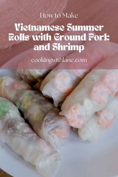 vietnamese summer rolls with ground pork and shrimp on a white plate next to pink napkin