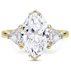 a yellow gold ring with an oval cut diamond and three pear shaped diamonds on the sides