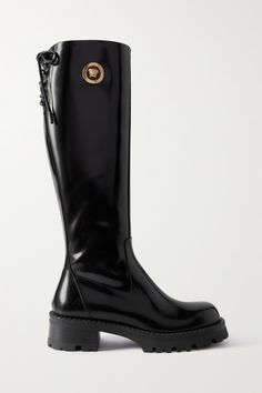 Among the vibrant hues and feminine silhouettes, Versace's latest collections have had a grungy undertone and these knee boots are the perfect expression of that. Made from glossy leather, this pair has lace-up tops and chunky soles. The eye-catching 'Medusa' plaques will make them the star of any outfit. Versace Boots, Italy 2023, Dr Closet, Leather Knee Boots, Versace Shoes, High Leather Boots, Tall Leather Boots, Fancy Shoes, Fame Dr