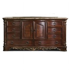 a large wooden dresser with marble top and drawers