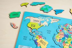 a map of the world is shown with magnets to show where countries are located