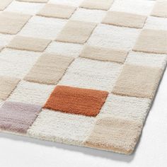 an area rug with different colored squares on it