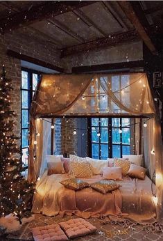 a bed with lights on it in a room next to a window and a christmas tree