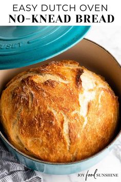 the best no - knead dutch oven bread is in a blue casserole dish