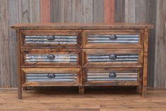 an old wooden dresser with metal drawers