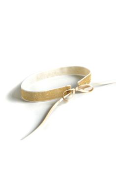 Elegant, sand-colored velvet choker with golden glitter elements. The jewelry is closed with two high-quality double-face satin ribbons that can be tied individually. The choker can be personalized upon request. Details: circumference of velvet ribbon approx. 30 cm, width of velvet 1.5 cm, total length of the choker including satin approx. 110 cm Material: 70% polyamide, 20% lurex, 10% polyester The jewelry is made in Germany and delivered in an organza bag. I do not offer a proof if an item is Satin Ribbons, Golden Glitter, Velvet Choker, Sand Color, Velvet Ribbon, Double Face, Organza Bags, Satin Ribbon, Choker Necklace