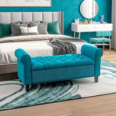 a bedroom with teal colored walls and furniture