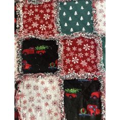 a quilted christmas blanket with cars and snowflakes on the front, in various colors