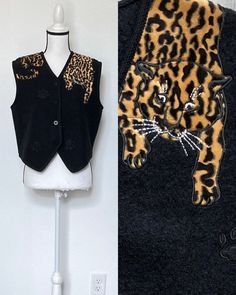 How fun and unique is this little vest?! Leopard curling around your shoulders on a boiled wool background. Description: Lisa International petite size PM (see measurements) black with leopard applique (sewn on) and paw prints button closure 100% boiled wool dry clean Vintage: 1990s Condition: great very little wear Measurements (taken while laying flat): approx 16.5" across shoulders approx 20.5" armpit to armpit approx 20" across waist/hips approx 8" arm opening approx 21" shoulder to hem (at longest point) The Fine Print: I provide  very detailed descriptions, measurements and photos. If you have a question, please ask. I will do my best to answer and give you peace of mind that you will be satisfied with your purchase. In the event that you are not satisfied, I do allow returns within Leopard Vest, Vintage Vest, Boiled Wool, Vest Outfits, Paw Prints, Animal Theme, Petite Size, Womens Vest, The Selection