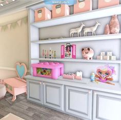 a pink and white room with toys on the shelves