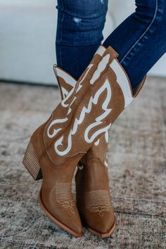 Details: Feeling Free Cowgirl Boots Contrast Embroidered Detailing Pointed Toe Slip On Thick Heel Pull on Tabs Padded Footbed Faux Leather/Suede Material Available in Camel Measurements: Shaft Height: 12" Heel Height: 3" Platform Height: 0.25" Shoe Opening Circumference: 14" We are recommending true to size for most comfort! Thick Heel, Suede Material, Thick Heels, Clothes Collection, Cowgirl Boots, Cardigan Jacket, Women Lingerie, Athleisure, Leather Women