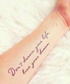 a person with a tattoo on their arm that says, don't dream your life isn't you dream