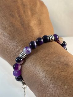 Stretch bracelet with 8mm purple agate banded beads; Awareness colors for Prematurity; Lupus; Alzheimer's and others. This is similar to the other awareness bracelet https://www.etsy.com/SGBead/listing/656409877/purple-agate-stretch-bracelet?utm_source=Copy&utm_medium=ListingManager&utm_campaign=Share&utm_term=so.lmsm&share_time=1643952458040   except this one has ribbed spacers.  Remember to roll your stretch bracelet on and roll it off.  Prevent them from getting wet and exposed to excess oil Alzheimer Bracelets, Chronic Migraine Awareness, Awareness Colors, Migraine Awareness, Healing Gemstone Bracelets, Chronic Migraines, Awareness Bracelet, Purple Bracelet, Purple Agate