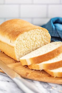 a loaf of bread sitting on top of a cutting board