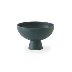 a gray bowl sitting on top of a white table