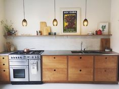 a kitchen with an oven, stove and sink