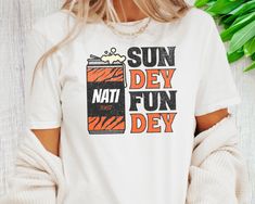 a woman wearing a t - shirt that says sun dew fun dey on it