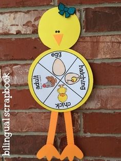 a clock that is on the side of a brick wall with an image of a chicken