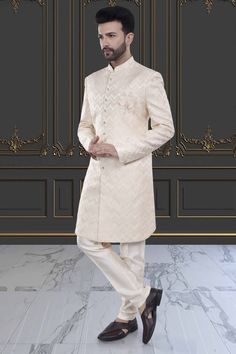 Embrace effortless elegance with our Mens Sherwani- V20-S46. Featuring a sleek design and a budget-friendly price, this sherwani effortlessly elevates your festive look. Experience the luxury of simplicity with our exquisite sherwani. Elegant Off-white Formal Sherwani, Luxury White Unstitched Sherwani, Luxury Off-white Traditional Sherwani, Bollywood Style Off-white Transitional Sherwani, Luxury Unstitched Off-white Sherwani, Mens Sherwani, Floral White, Budget Friendly, Sleek Design