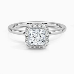 an engagement ring with a square cut diamond in the center