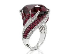 An Absolutely Amazing 18k white gold Swirl Ring with 2.93ctw of DIamonds H/VS2 and Deep Blush Rhodolite Garnet that weighs 30.36ct. Entire Ring weighs 15.5 grams. Current Finger Size is 6.5, can be sized to fit! Colored Diamonds Engagement, Swirl Diamond Ring, Expensive Jewelry Luxury, Sapphire Rings, Swirl Ring, Garnet Jewelry, Ring Ideas, Ruby Sapphire, Expensive Jewelry