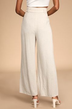 Look like a page out of style section in the Lulus Trend Alert Beige Belted High-Waisted Wide-Leg Pants! Linen-blend woven fabric shapes these breezy pants that have a high-waisted fit with belt loops and a sash belt. The wide legs have tailored pleating, side pockets, and end at ankle-length hems. Top button and hidden zipper fly. Fabric: Fabric has no stretch. Unlined. shell: 93% rayon. 7% linen. lining:100% rayon. Hand wash cold. Do not bleach. Line dry. Iron low heat. Imported. Lulus | Trend Chic Summer Pants With Wide Waistband, Chic Pants With Wide Waistband For Summer, Chic Wide-leg Pants With Wide Waistband, Spring High Waist Wide Leg Pants With Wide Waistband, High Waist Pants With Wide Waistband For Summer, Chic Pants With Wide Waistband For Spring, Non-stretch Linen Beach Bottoms, Elegant Relaxed Fit Beach Bottoms, Elegant Beach Bottoms With Elastic Waistband