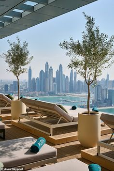 an outdoor lounge area overlooking the city skyline