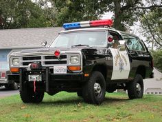 a police car parked in front of a house