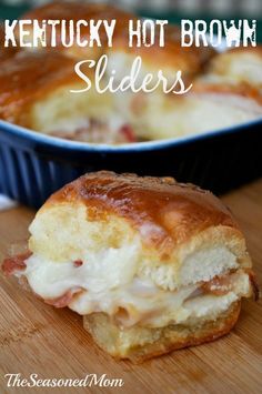 a close up of a pastry on a wooden table with the words kentucky hot brown sliders