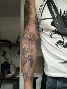 a man with a tattoo on his arm